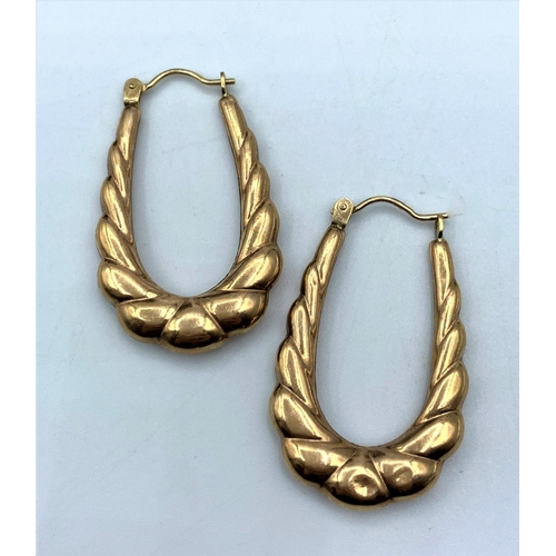 55 - Pair of Yellow Metal horseshoe shaped Earrings, weight 1.6g and 3cm long approx