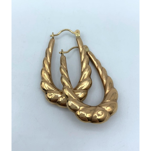 55 - Pair of Yellow Metal horseshoe shaped Earrings, weight 1.6g and 3cm long approx