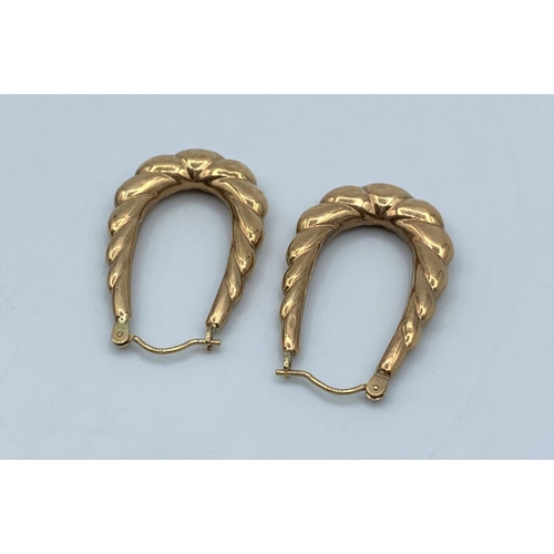 55 - Pair of Yellow Metal horseshoe shaped Earrings, weight 1.6g and 3cm long approx