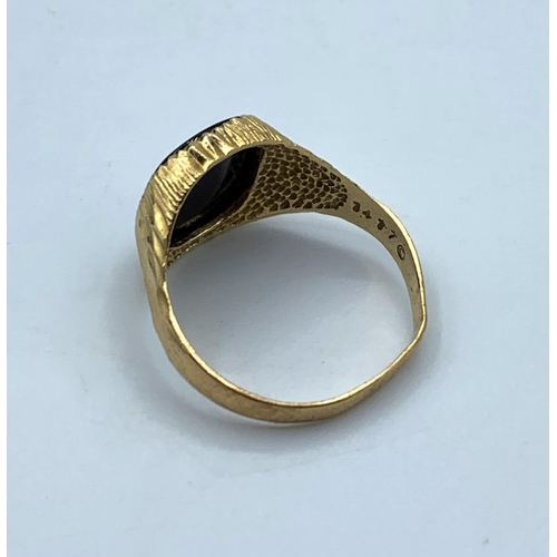 65 - 9CT Yellow Gold Gent Ring with square black stone centre, size Q and weight 3.2g approx