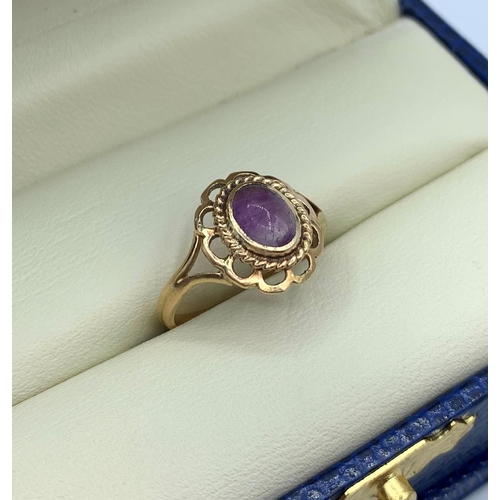 75 - Vintage 9CT yellow Gold Ring with purple stone centre, size H and weight 1.7g approx