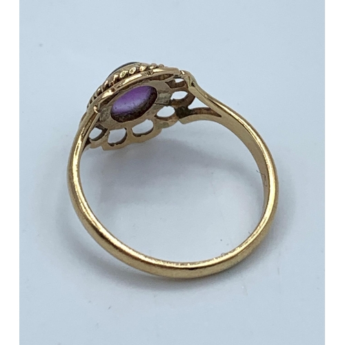 75 - Vintage 9CT yellow Gold Ring with purple stone centre, size H and weight 1.7g approx