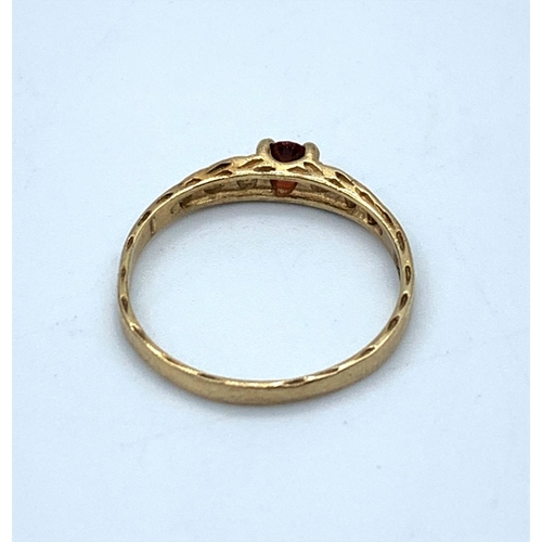 88 - Yellow Metal Vintage Ring with red stone centre, size H1/2