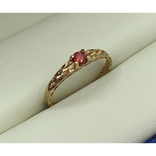 88 - Yellow Metal Vintage Ring with red stone centre, size H1/2