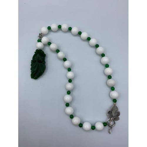 229 - Chinese White and Green Jade Necklace and Earrings set, weight 178g