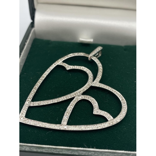 324 - 18CT WHITE GOLD DIAMOND SET OPEN HEART PENDANT, WEIGHT 5.9G AND 0.50CT DIAMOND APPROX, 5CM LONG