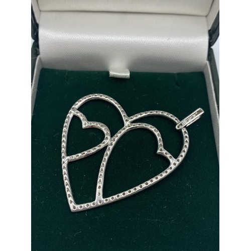 324 - 18CT WHITE GOLD DIAMOND SET OPEN HEART PENDANT, WEIGHT 5.9G AND 0.50CT DIAMOND APPROX, 5CM LONG