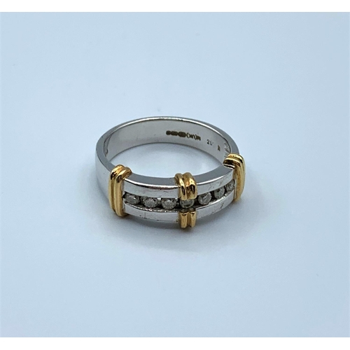 330 - 9ct White Gold Ring trimmed with yellow gold having 7 small Diamonds, weight 4.9g and size N/O