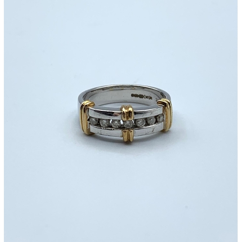 330 - 9ct White Gold Ring trimmed with yellow gold having 7 small Diamonds, weight 4.9g and size N/O