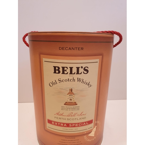 199 - Bells Scotch Whisky Decanter by WADE in original cylindrical carton , 22x16cm