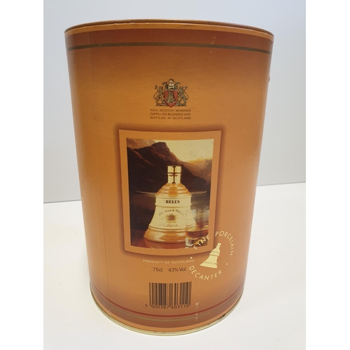 199 - Bells Scotch Whisky Decanter by WADE in original cylindrical carton , 22x16cm