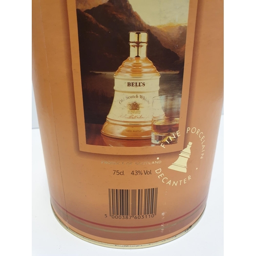 199 - Bells Scotch Whisky Decanter by WADE in original cylindrical carton , 22x16cm