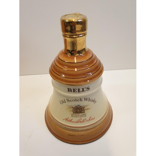 199 - Bells Scotch Whisky Decanter by WADE in original cylindrical carton , 22x16cm