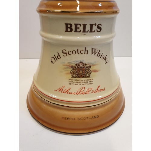 199 - Bells Scotch Whisky Decanter by WADE in original cylindrical carton , 22x16cm