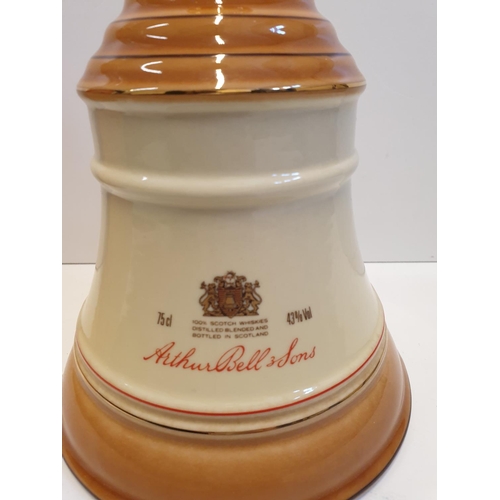 199 - Bells Scotch Whisky Decanter by WADE in original cylindrical carton , 22x16cm