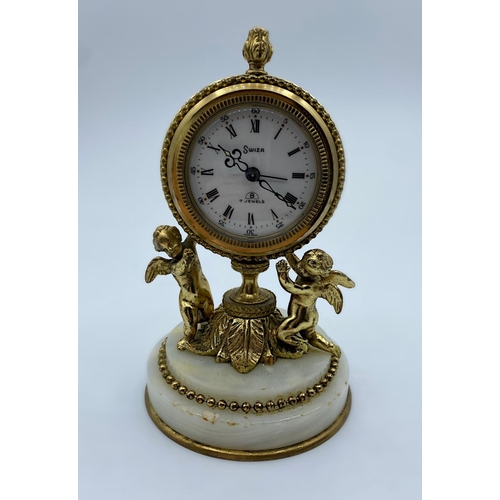 28 - Vintage 8 Day Swiza Clock with alarm on a marble base supported by 2 Cherubs, 14cm tall and weight 7... 