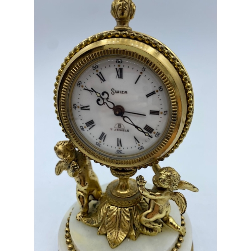 28 - Vintage 8 Day Swiza Clock with alarm on a marble base supported by 2 Cherubs, 14cm tall and weight 7... 