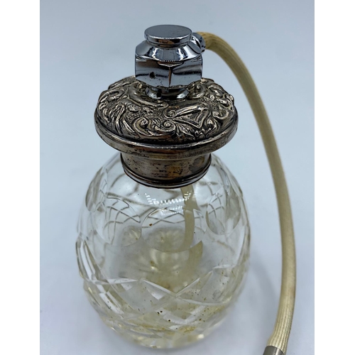 34 - Antique cut glass Scent Bottle with ornate Silver top and working Puffer, weight 289g and 11cm tall ... 