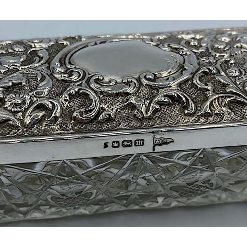 38 - Cut Glass Trinket Box with an ornate Silver Lid by Walker & Hall dated 1904, weight 233g and 14.5cm ... 