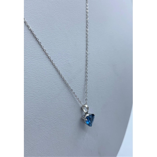 154 - 9K White Gold Chain with a Blue Stone Pendant, weight 1.4g and 44cm long chain