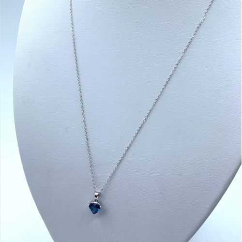 154 - 9K White Gold Chain with a Blue Stone Pendant, weight 1.4g and 44cm long chain