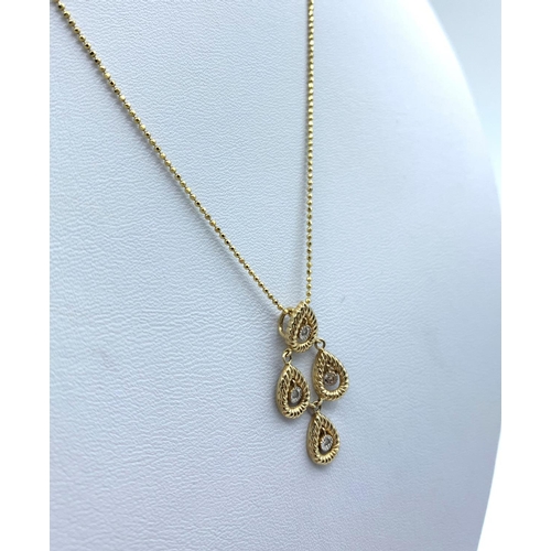 168 - Diamond Drop Pendant in 18K Gold on a 9K Gold Chain, weight 3.1g and 36cm long chain