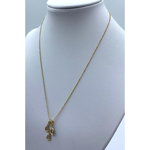 168 - Diamond Drop Pendant in 18K Gold on a 9K Gold Chain, weight 3.1g and 36cm long chain