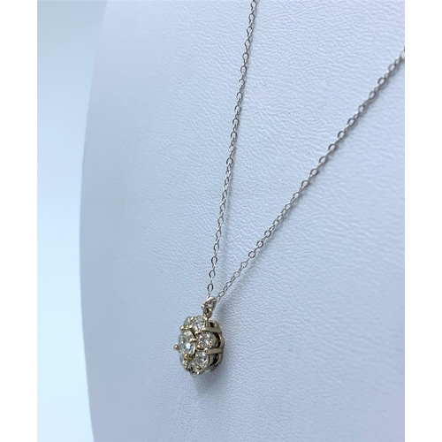 170 - Diamond Cluster Floral Pendant in 18K Gold on a 9ct Gold Chain, weight 1.7g