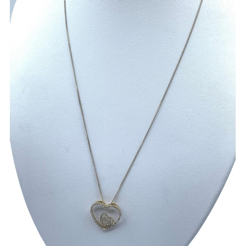 176 - Diamond encrusted Double Heart designed Pendant on a 42cm long 9K Gold Chain, weight 2.9g