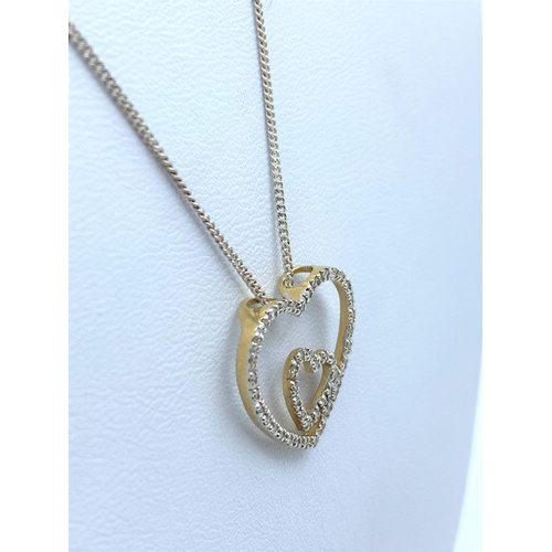 176 - Diamond encrusted Double Heart designed Pendant on a 42cm long 9K Gold Chain, weight 2.9g