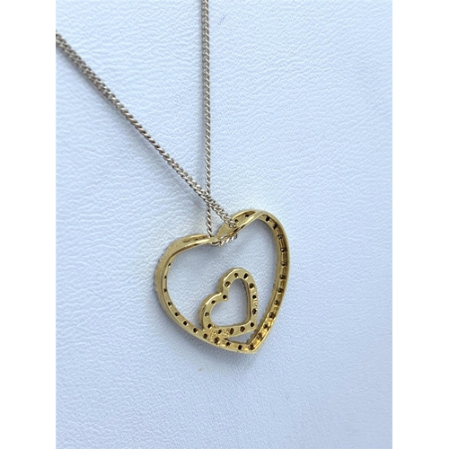 176 - Diamond encrusted Double Heart designed Pendant on a 42cm long 9K Gold Chain, weight 2.9g