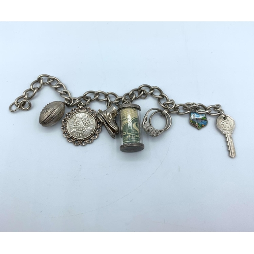 282 - Vintage Silver Charm Bracelet with 7 Charms. 32.9g. 15cm