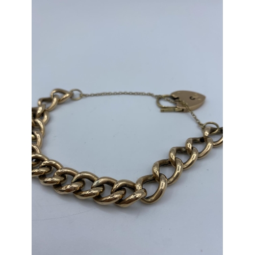 284 - 9ct Rose Gold chunky Curb Bracelet with heart padlock, and safety chain weight 15.58g approx