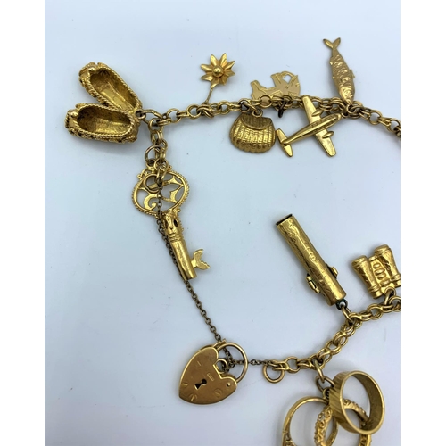 292 - A 9ct yellow Gold Charm Bracelet with 15 interesting charms, weighing 29.9g.