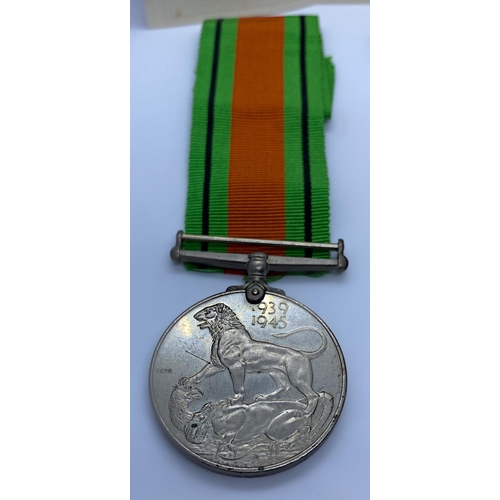 203 - 1935-45 Service Medal and a 1939-45 Defence Medal with Ribbons and Original Printed note from the Se... 