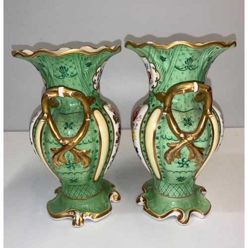 336 - Pair of Rococo style handled Urns in green with floral design to front and rear panels, 24cm tall (2... 