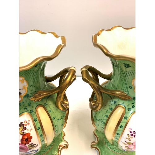 336 - Pair of Rococo style handled Urns in green with floral design to front and rear panels, 24cm tall (2... 