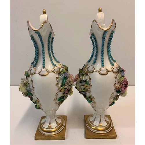 349 - Pair of Baroque ornate Vases with handles on a gold base, 28cm tall with raised flower to both sides... 