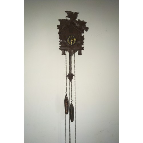 151 - Vintage Swiss Cuckoo Clock chiming mechanical bellows pop out cuckoo and 2 pine cone shaped weights.... 