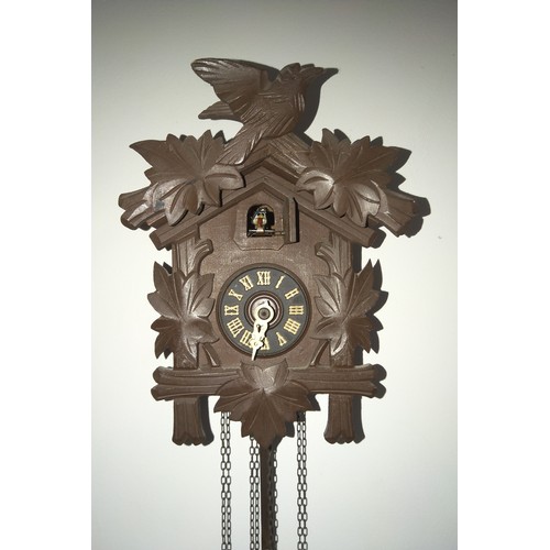 151 - Vintage Swiss Cuckoo Clock chiming mechanical bellows pop out cuckoo and 2 pine cone shaped weights.... 