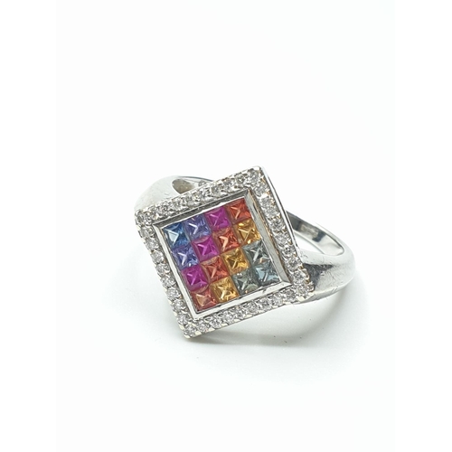 21 - Stone set 9ct White Gold Ring having various coloured gemstones to top of the square set mount, a di... 