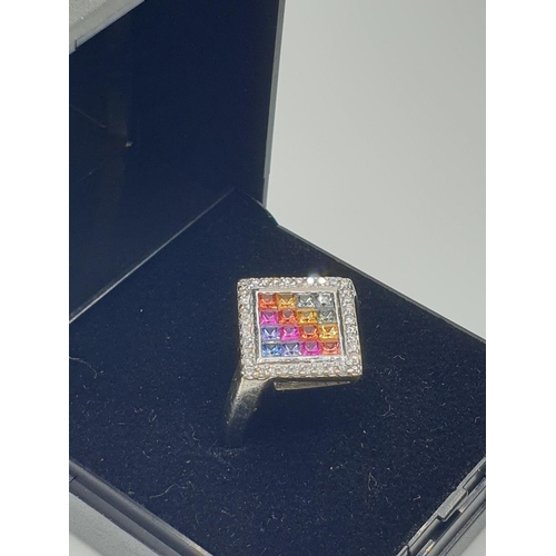 21 - Stone set 9ct White Gold Ring having various coloured gemstones to top of the square set mount, a di... 