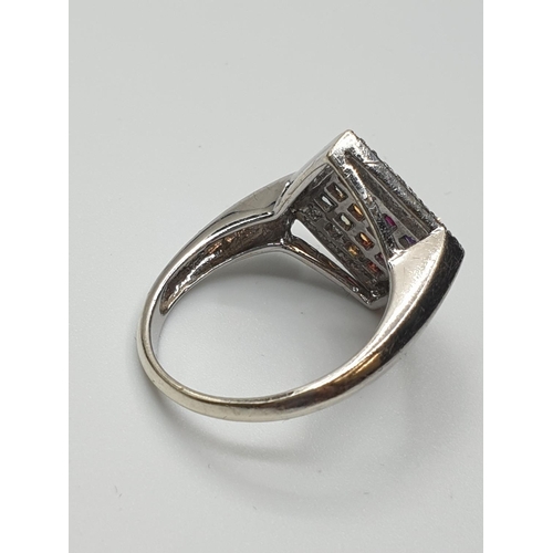 21 - Stone set 9ct White Gold Ring having various coloured gemstones to top of the square set mount, a di... 