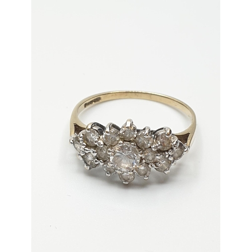 39 - Stone set 9ct Yellow Gold Cluster Ring, having a large centre clear stone  with a 14 Zirconia surrou... 