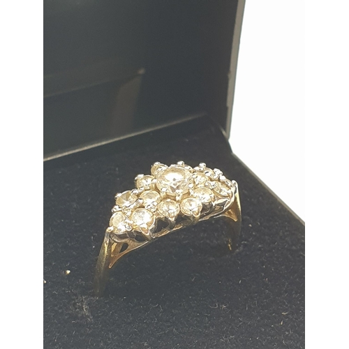 39 - Stone set 9ct Yellow Gold Cluster Ring, having a large centre clear stone  with a 14 Zirconia surrou... 