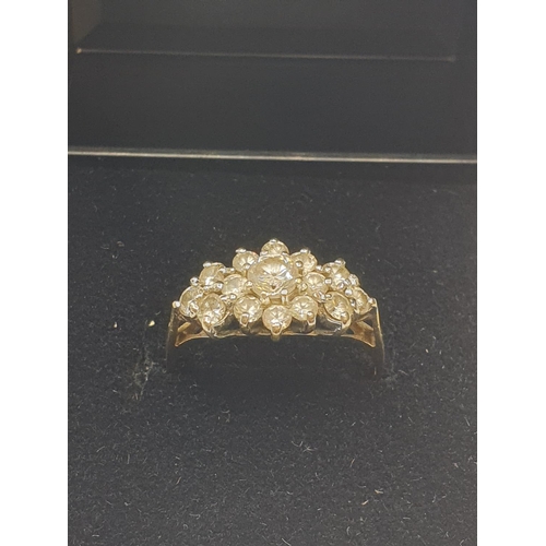 39 - Stone set 9ct Yellow Gold Cluster Ring, having a large centre clear stone  with a 14 Zirconia surrou... 