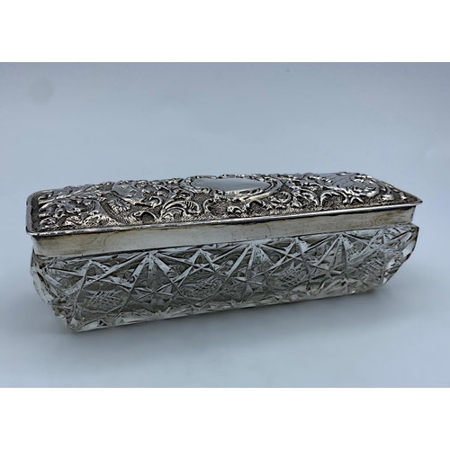 38 - Cut Glass Trinket Box with an ornate Silver Lid by Walker & Hall dated 1904, weight 233g and 14.5cm ... 