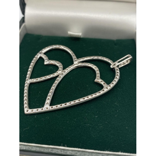 324 - 18CT WHITE GOLD DIAMOND SET OPEN HEART PENDANT, WEIGHT 5.9G AND 0.50CT DIAMOND APPROX, 5CM LONG