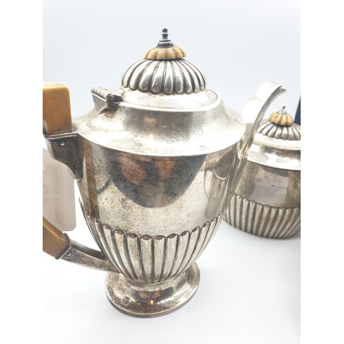 297 - Silver German made tea/coffee set comprising of teapot, coffee pot and sugar bowl made in 800 silver... 