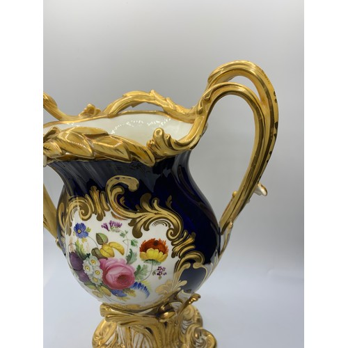 3 - A pair of H&R Daniel Baroque Vases glazed blue with gilded handles and laurels, slight hairline crac... 